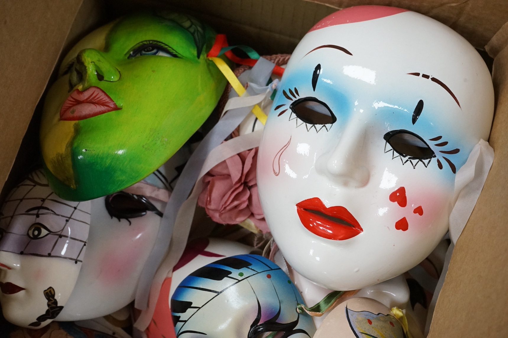 A large collection of various painted wall masks. Condition - varies